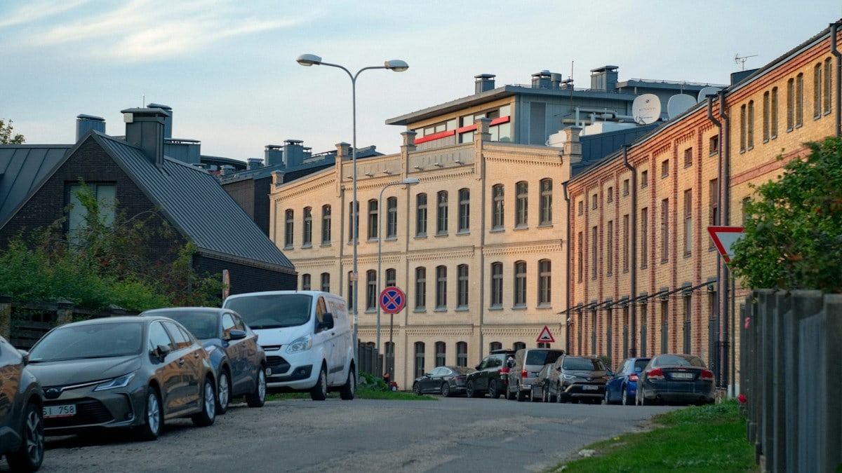 A bunch of cars parked on the side of a road